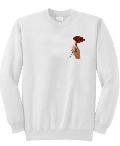 A rose flower in hand sweatshirt